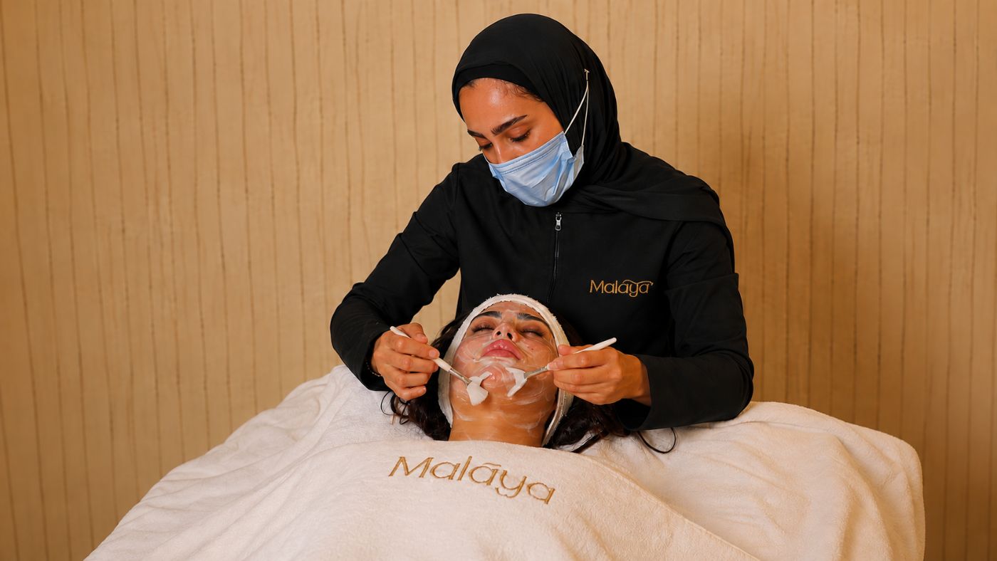 Nadine receiving the final step of a Transformation Facial